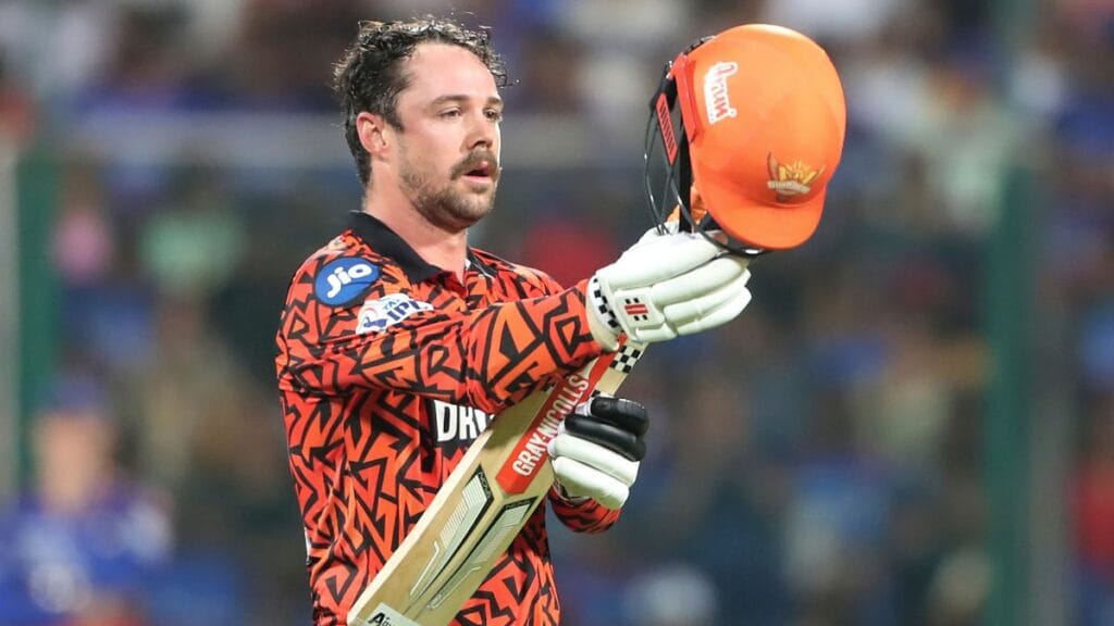 Travis Head raising his bat after scoring a quick fifty in IPL 2025.
